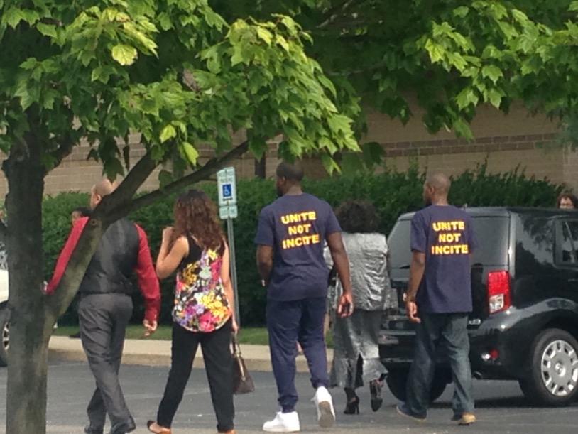 protesters wearing unite not incite shirts